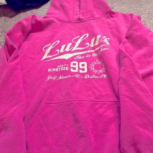 This is a pink sweatshirt that is a size large